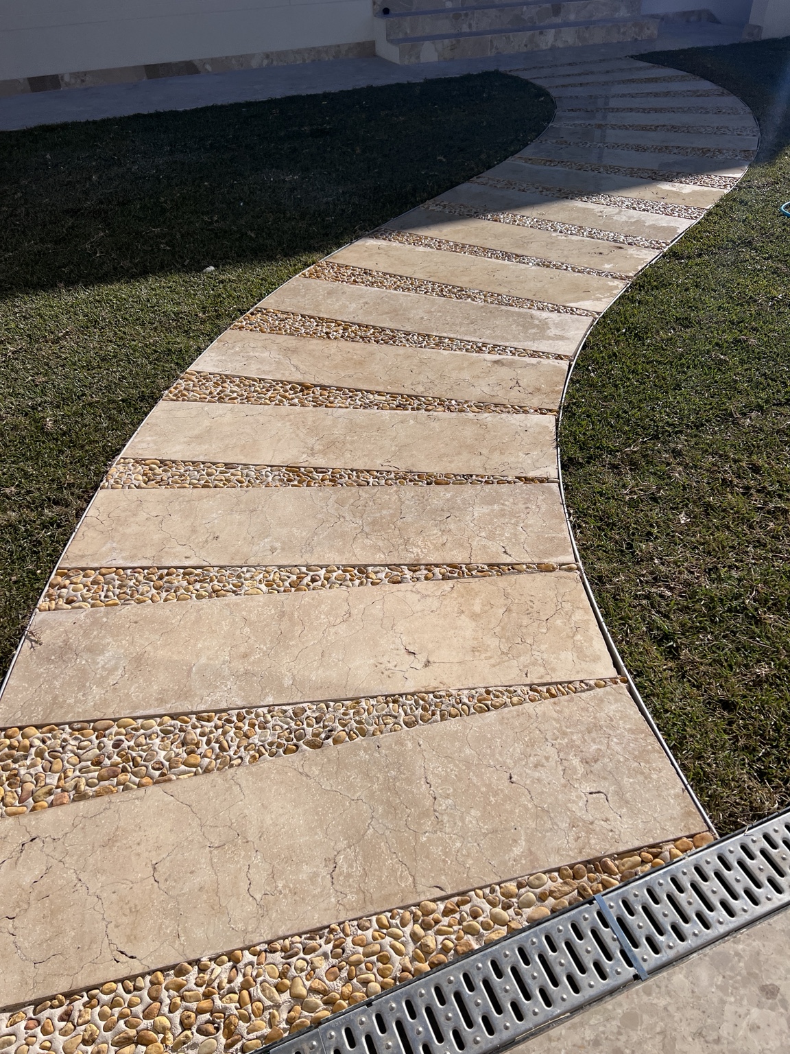 Curved stone & pebble pathway