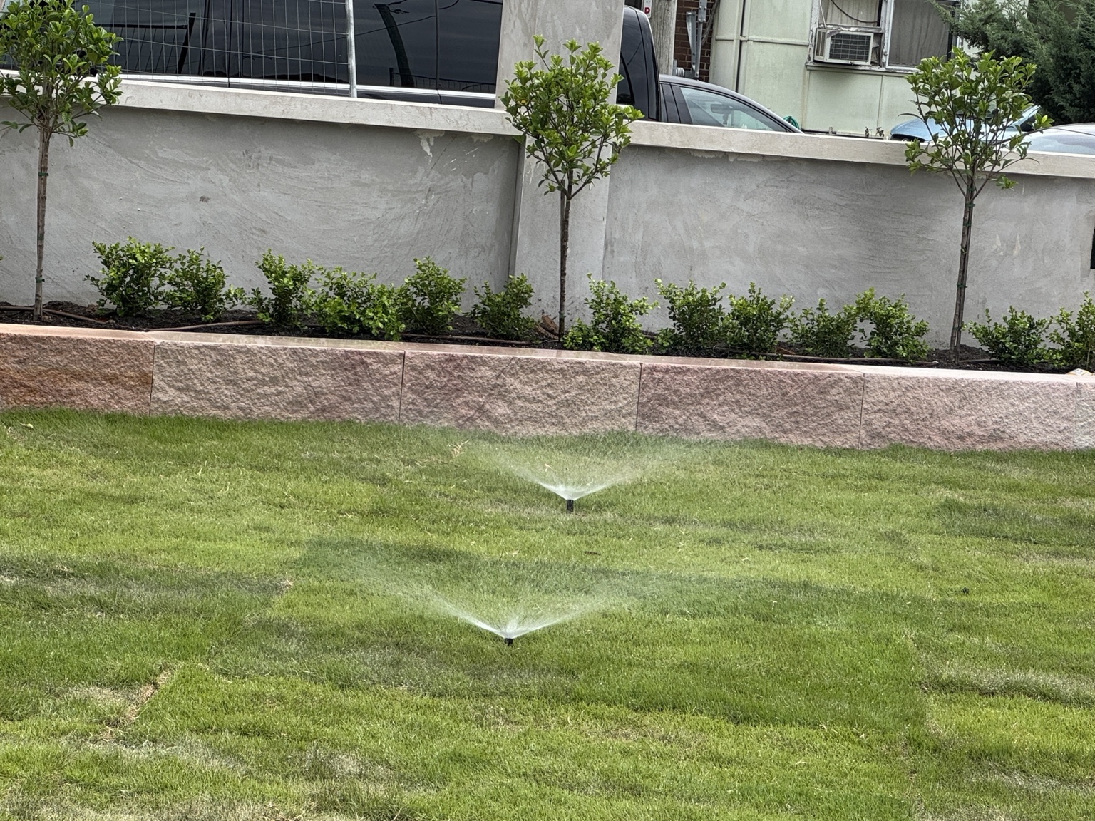 Lawn, irrigation & sandstone edging